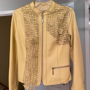 Leather jacket with cut out leather design.